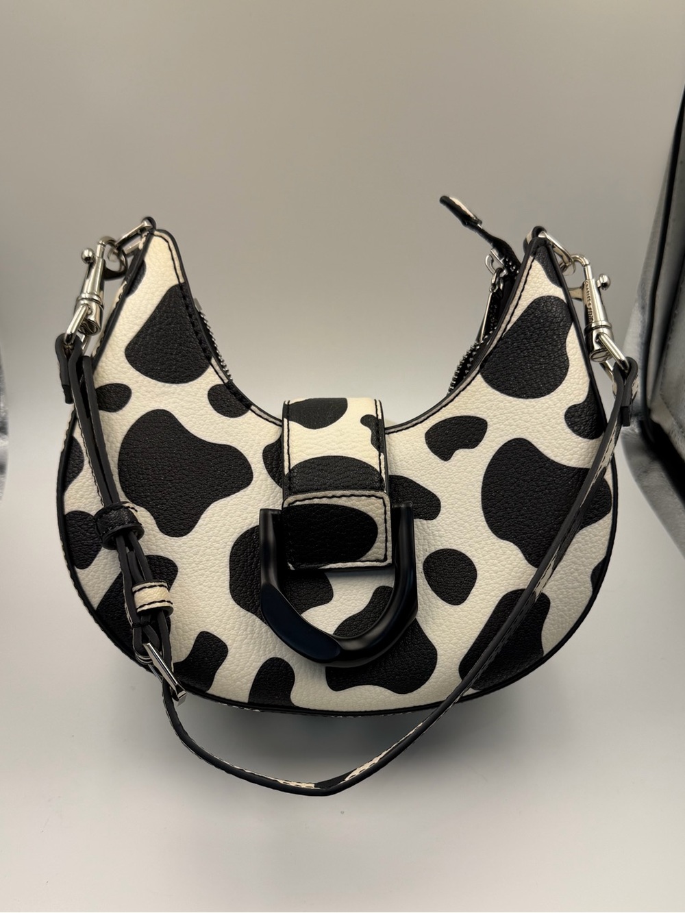 CHARLES & KEITH x ITZY Cow Print Gabine Belted Hobo Bag